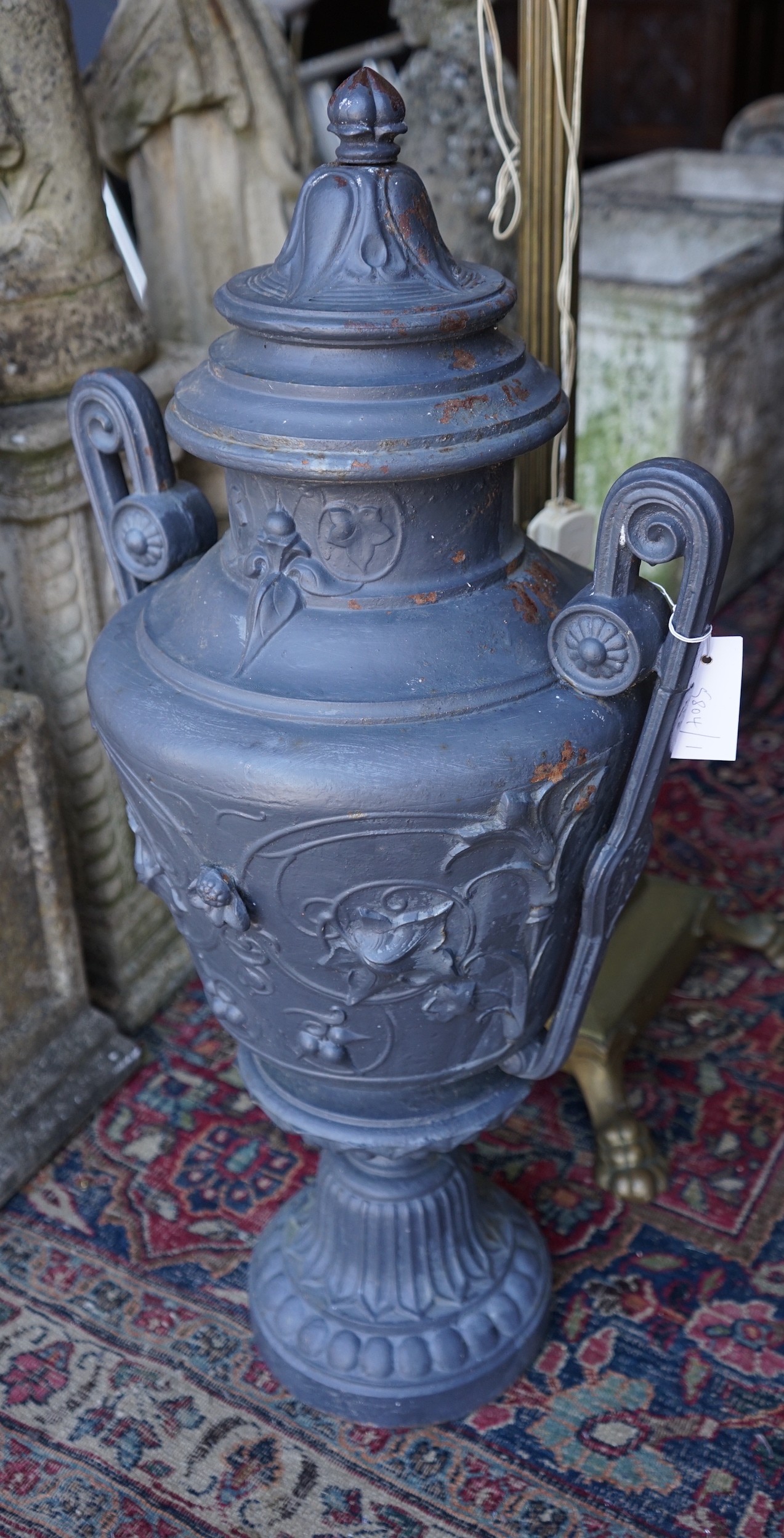 A painted cast iron two handled garden urn, height 80cm